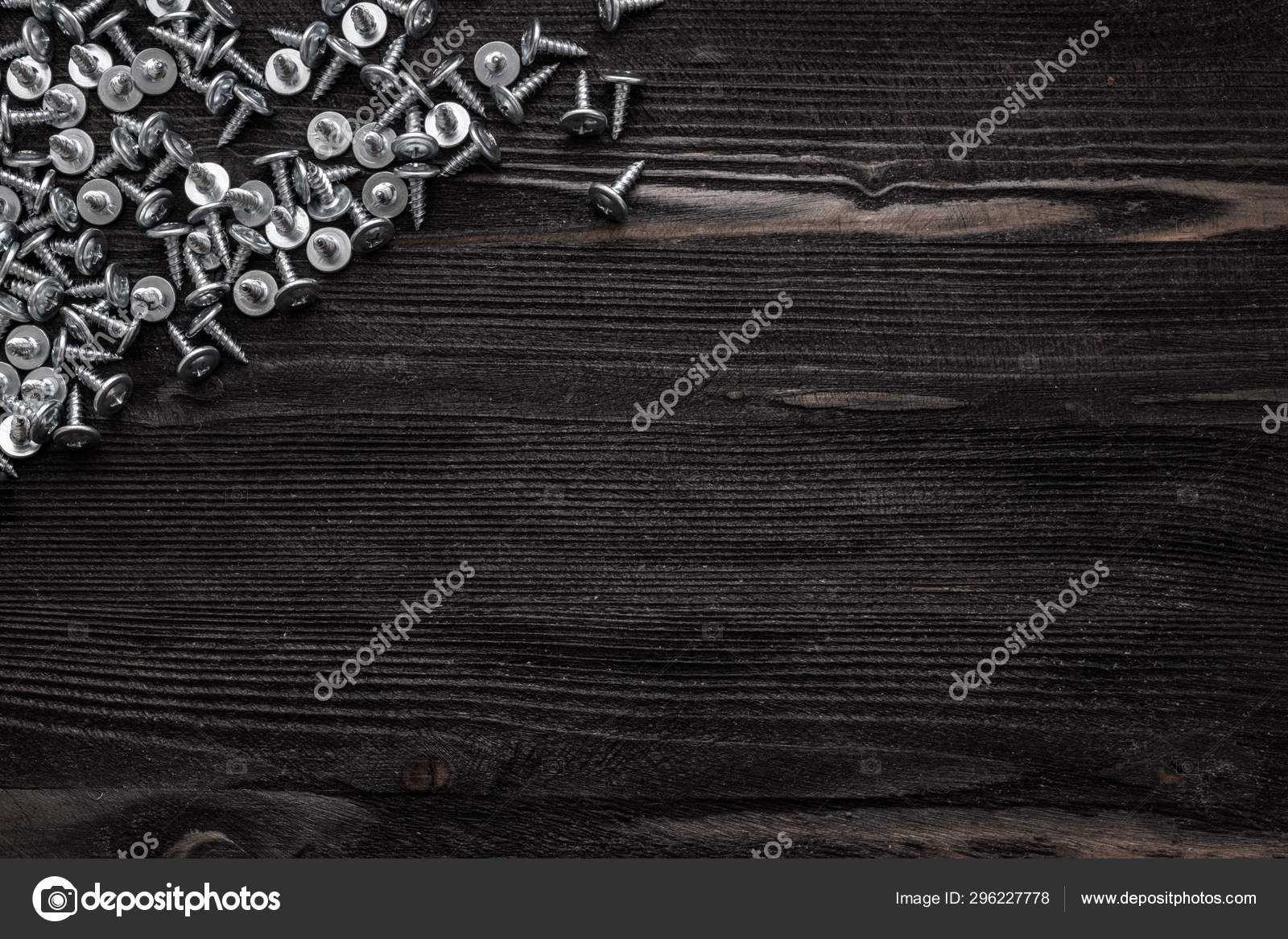 Some Wood Crews On Dark Wooden Desk Board Surface. Top View Intended For Borderless Certificate Templates